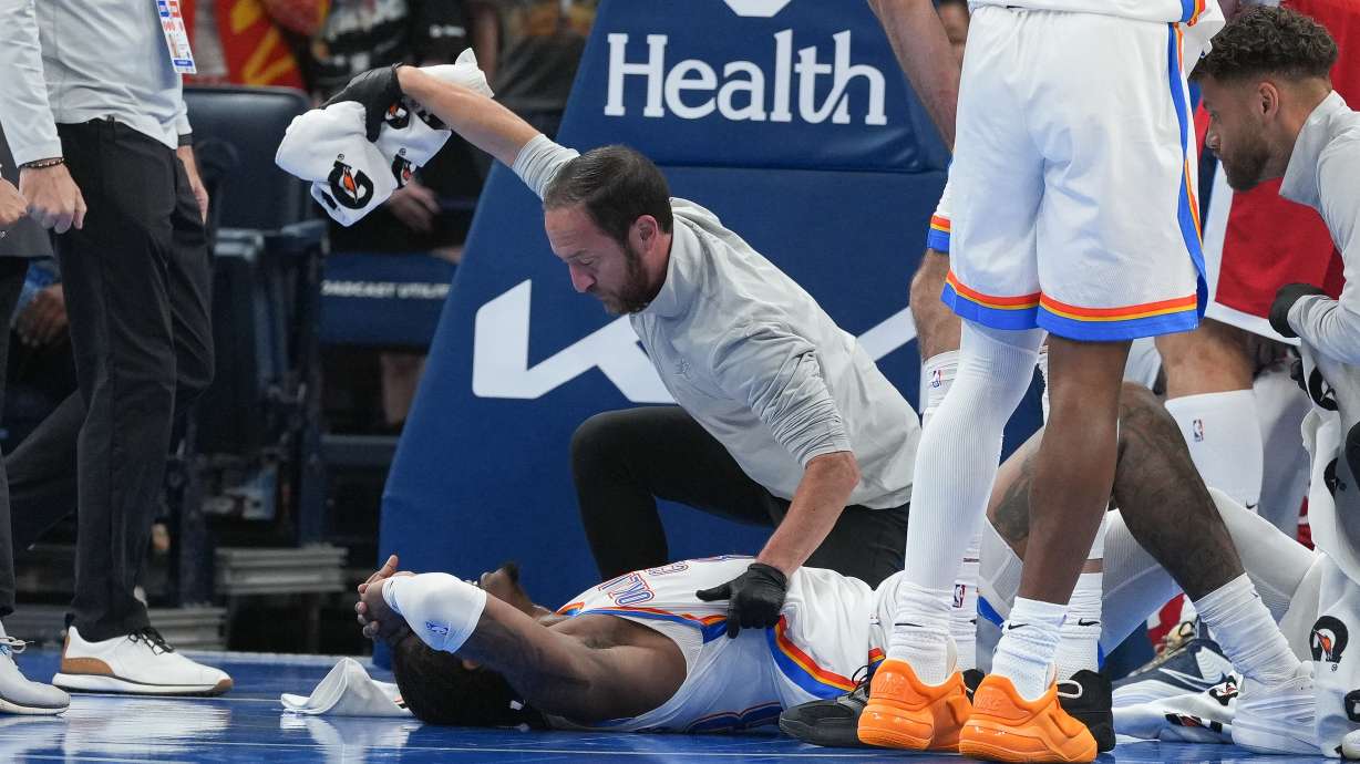 Oklahoma City Thunder guard Jalen Williams is attended to by medical staff during the second half of an NBA basketball game against the Los Angeles Clippers, Sunday, Oct. 25, 2026, in Oklahoma City.