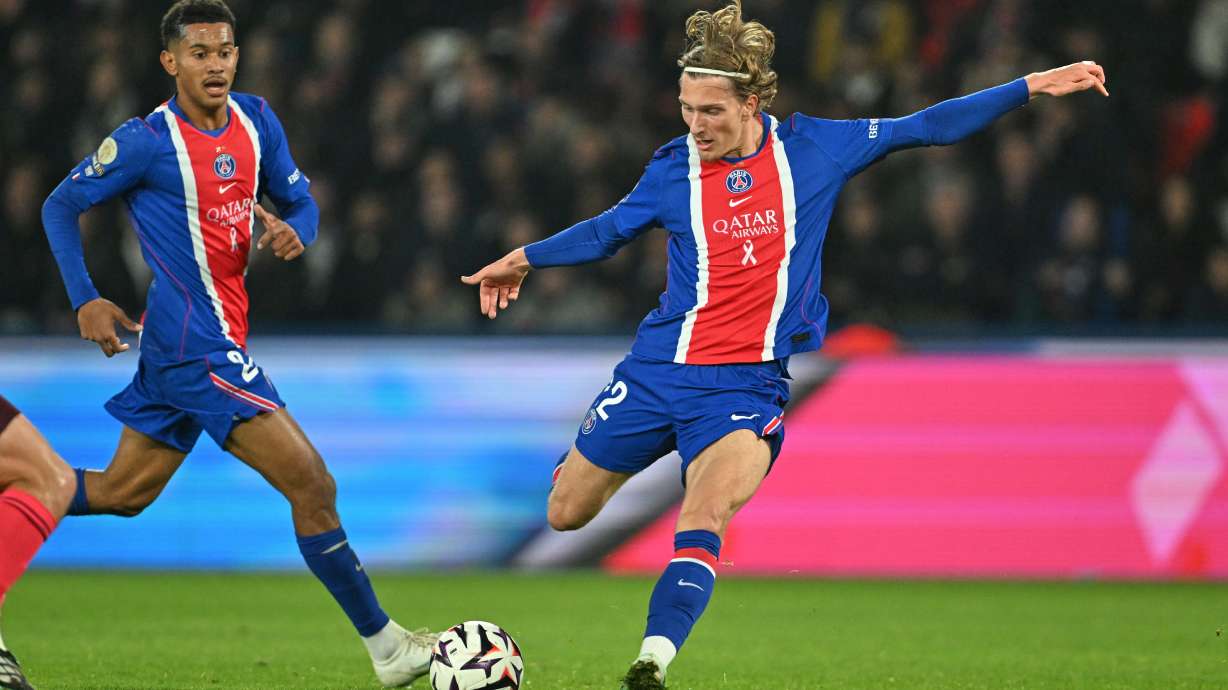 PSG's Mika Godts scores his side's second goal during the French League One soccer match between Paris Saint-Germain and Lyon in Paris, Monday, Oct. 26, 2026.