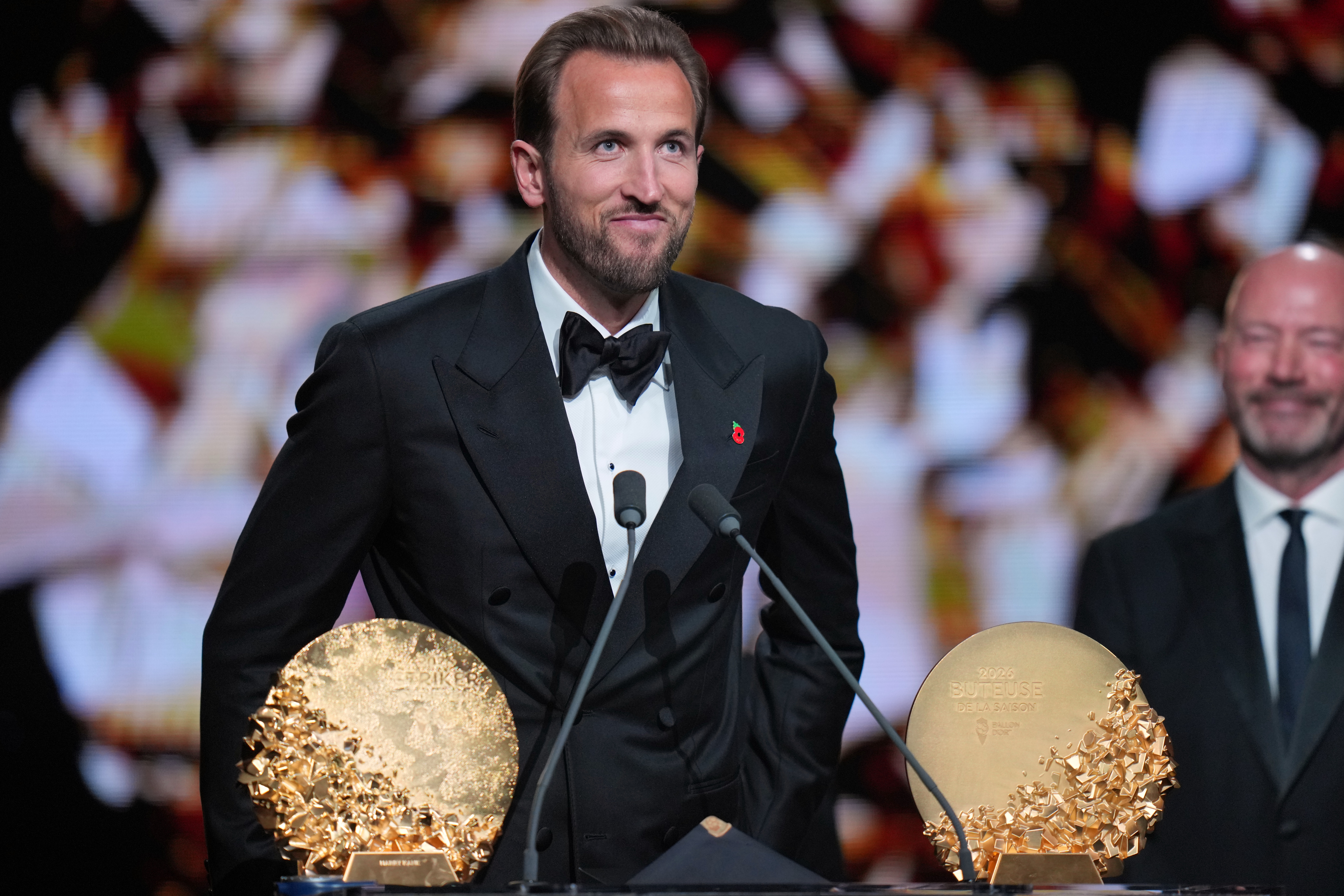 England's soccer player Harry Kane wins the trophy for striker of the year during the Ballon d'Or ceremony at the London Palladium Theatre in London, England, Monday, Oct. 26, 2026 . 