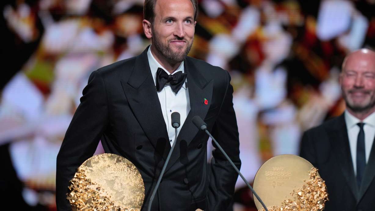 England's soccer player Harry Kane wins the trophy for striker of the year during the Ballon d'Or ceremony at the London Palladium Theatre in London, England, Monday, Oct. 26, 2026 .