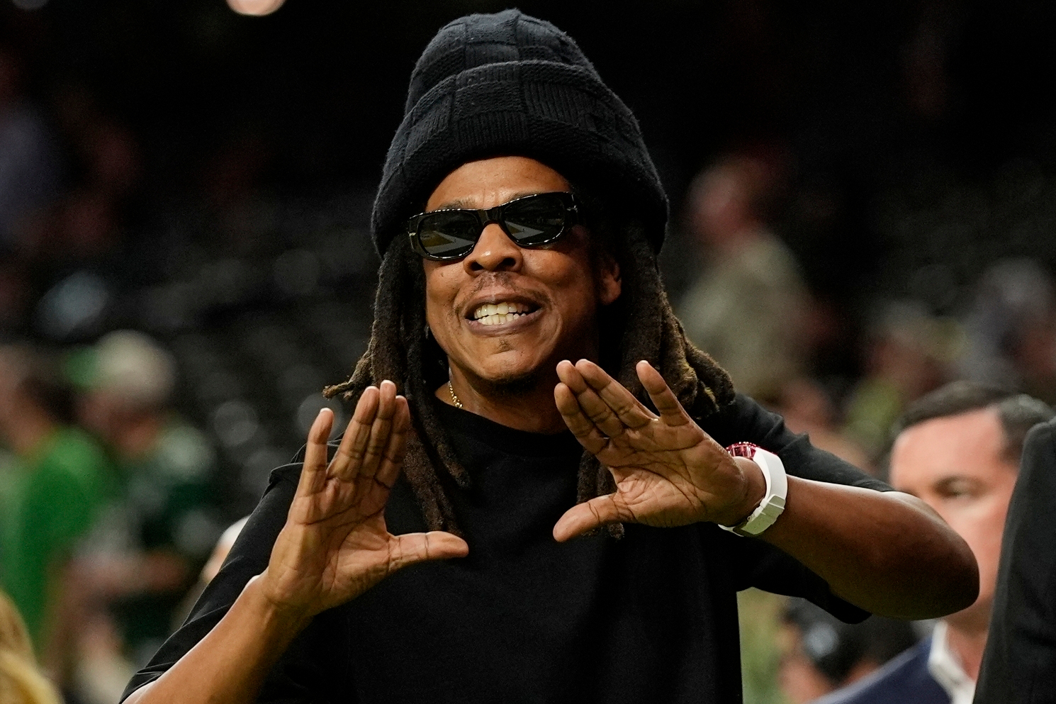 FILE - Jay-Z gestures from the sidelines prior to the NFL Super Bowl 59 football game, Feb. 9, 2025, in New Orleans. 