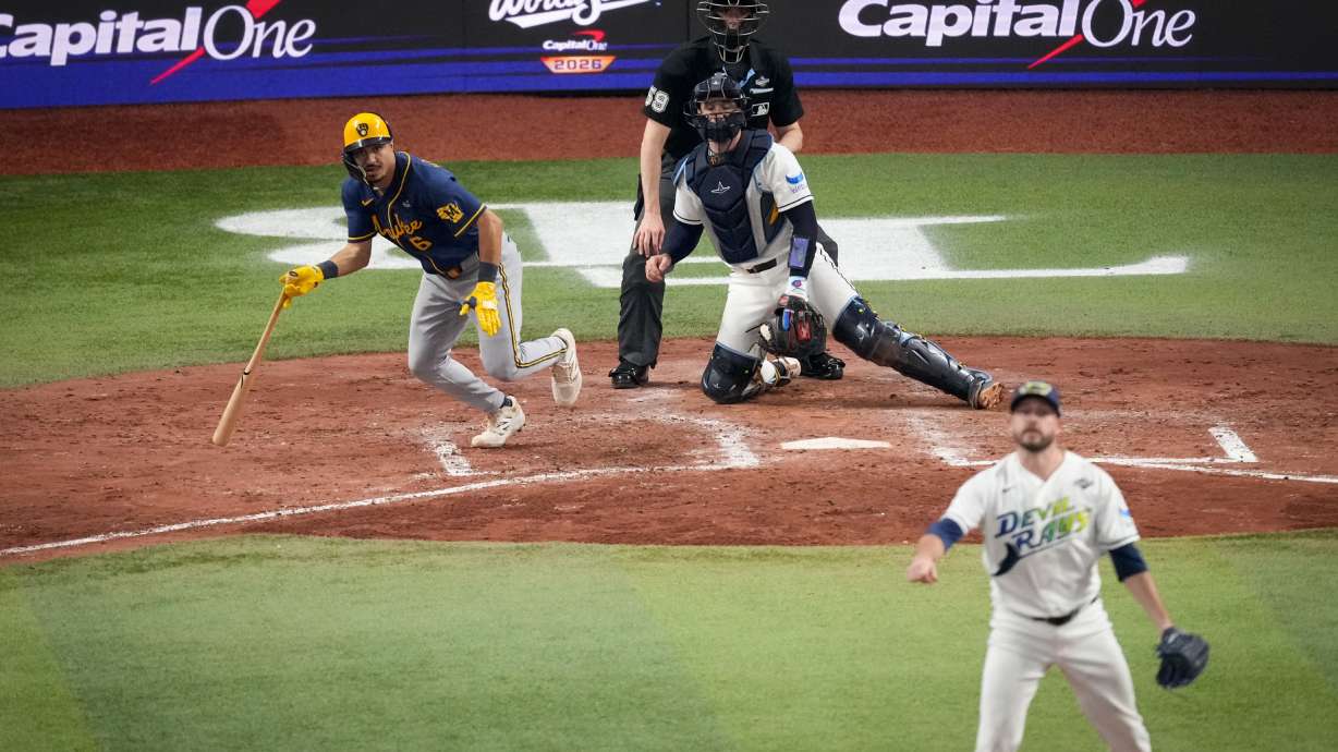 Milwaukee Brewers third baseman David Hamilton, left, Tampa Bay Rays catcher Nick Fortes, center, and pitcher Cole Sulser, right, watch his RBI base hit during the fifth inning of Game 3 of baseball's World Series, Monday, Oct. 26, 2026, in St. Petersburg, Fla., between the Milwaukee Brewers and the Tampa Bay Rays.