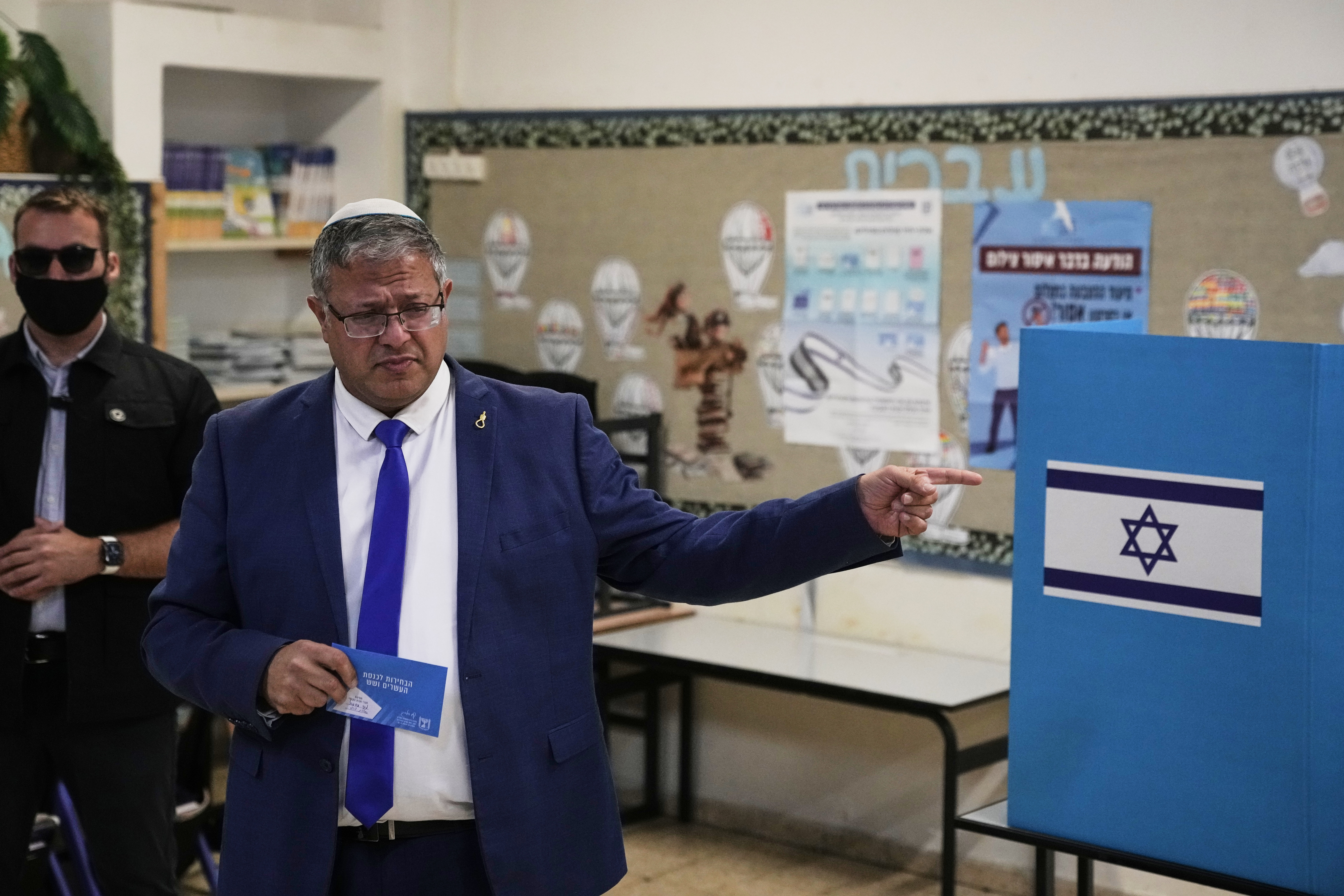 National Security Minister Itamar Ben-Gvir, head of the Otzma Yehudit party, casts his vote during Israel's general elections in the West Bank settlement of Kiryat Arba, Tuesday. Ben-Gvir said it will be "Mansour Abbas' government" if Netanyahu and his allies don't win the election.