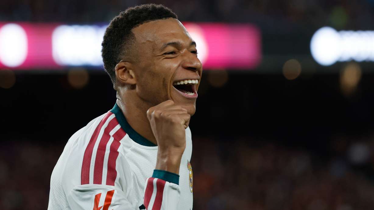 Real Madrid's Kylian Mbappe celebrates after scoring his side's opening goal during a Spanish La Liga soccer match between FC Barcelona and Real Madrid in Barcelona, Spain, Sunday, Oct. 25, 2026.