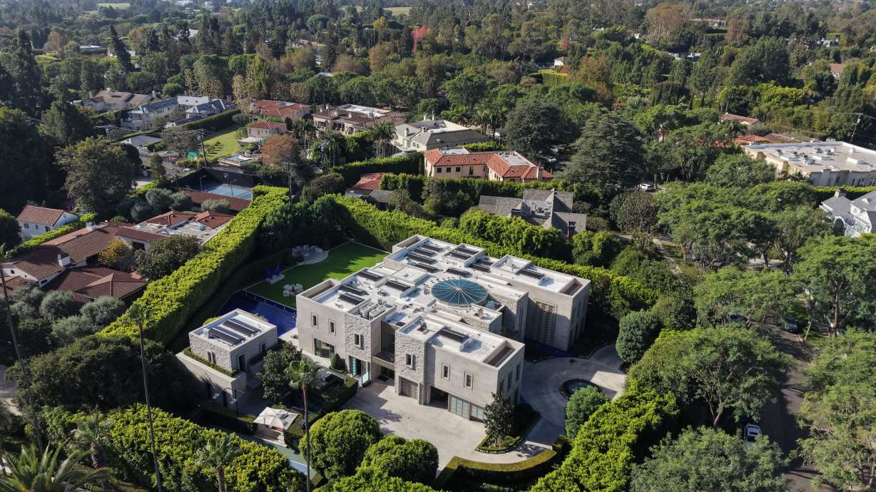 The exterior of a home belonging to Stephen Cloobeck is shown on Tuesday, in Beverly Hills, Calif. The home where former Rep. Eric Swalwell, D-Calif., resided for a time was reportedly searched by federal agents.