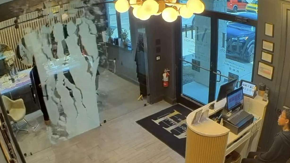 A glass door suddenly shatters at Modern Halo Head Spa and Dry Bar in Katy, Texas.