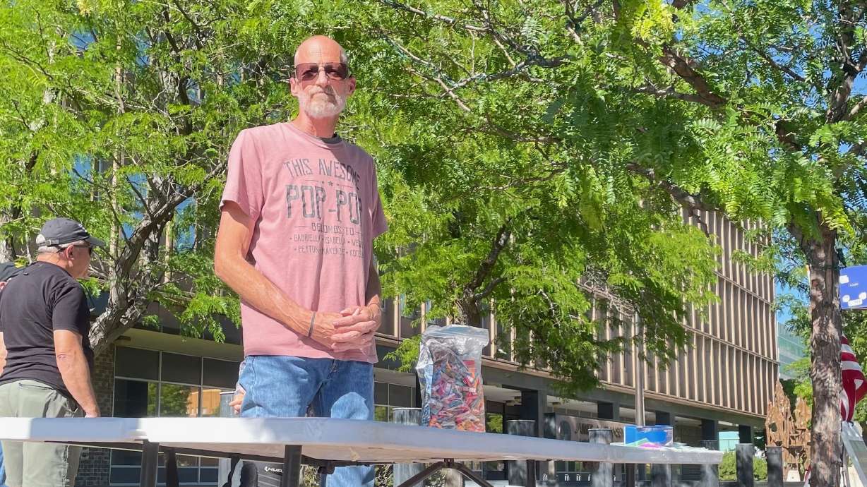 David Belnap plans to fight a misdemeanor count he faces for allegedly placing a sign identifying a license-plate reader located in Marriott-Slaterville. He's pictured June 10, at a small demonstration in Ogden.