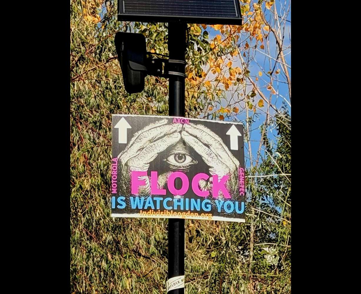 The photo shows one of the signs David Belnap placed on a license-plate reader. He faces a misdemeanor count for placing one of the signs on the pole holding a camera in Marriott-Slaterville on Sunday.