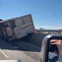 Cattle hauler overturns on I-84 in Weber County, causes delays