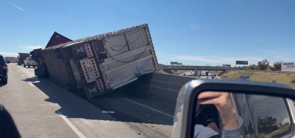 Cattle hauler overturns on I-84 in Weber County, causes delays