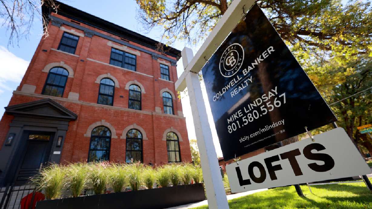 A for-sale sign advertises lofts in Salt Lake City on Wednesday. As the Federal Reserve concludes its latest policy meeting, economists expect no immediate change to interest rates, though another increase remains possible before year's end.