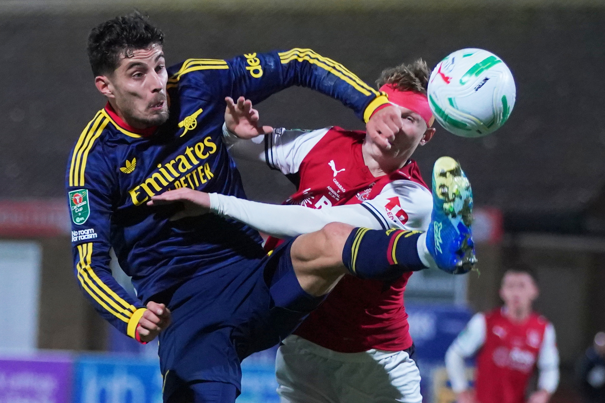 Arsenal's Kai Havertz, left, challenges for the ball with Fleetwood's Finley Potter during the English League Cup soccer match between Fleetwood Town and Arsenal in Fleetwood, England, Tuesday, Oct. 27, 2026. 
