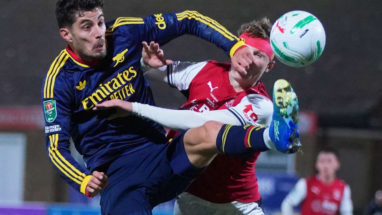 Arsenal's Kai Havertz, left, challenges for the ball with Fleetwood's Finley Potter during the English League Cup soccer match between Fleetwood Town and Arsenal in Fleetwood, England, Tuesday, Oct. 27, 2026.