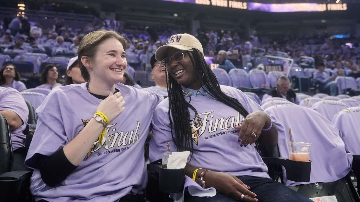 Golden State Valkyries fans Kendall Christmas-Miller, left, smiles with her wife, Shaunice Christmas-Miller, while being interviewed before Game 5 of the WNBA basketball finals between the Valkyries and the Atlanta Dream, Monday, Oct. 26, 2026, in San Francisco.