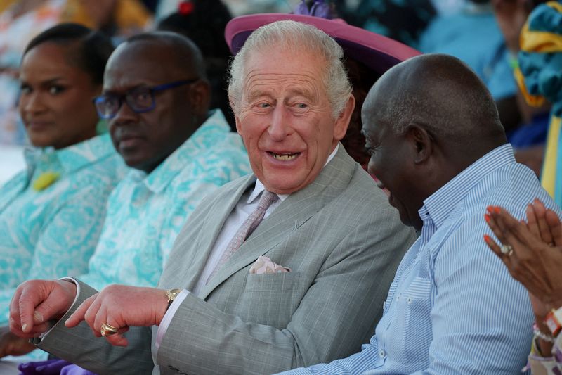 Britain's King Charles and Philip Davis, Prime Minister of The Bahamas, sit together at a youth rally in Clifford Park, as part of an autumn tour of Caribbean nations, including a state visit to Guyana and attendance at the Commonwealth Heads of Government Meeting (CHOGM), in Nassau, The Bahamas, Tuesday.
