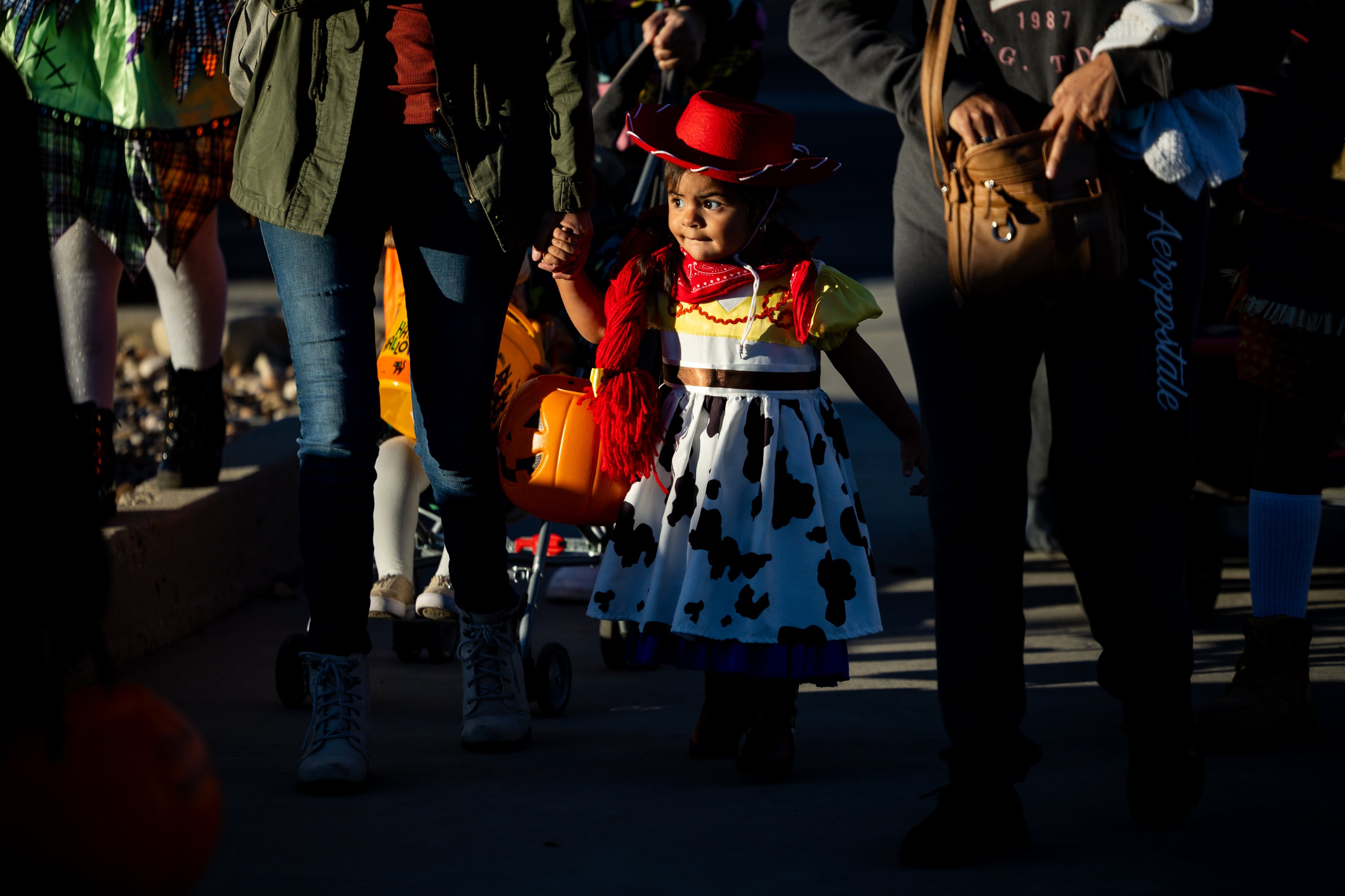 Yaretzi Ruiz, 2, dressed as Jessie from “Toy Story,” trick-or-treats during the Tooele City Downtown Halloween Trick-or-Treat Main Street in Tooele on Oct. 31, 2025. Microplastics can be released when Halloween costumes are washed, an expert said.
