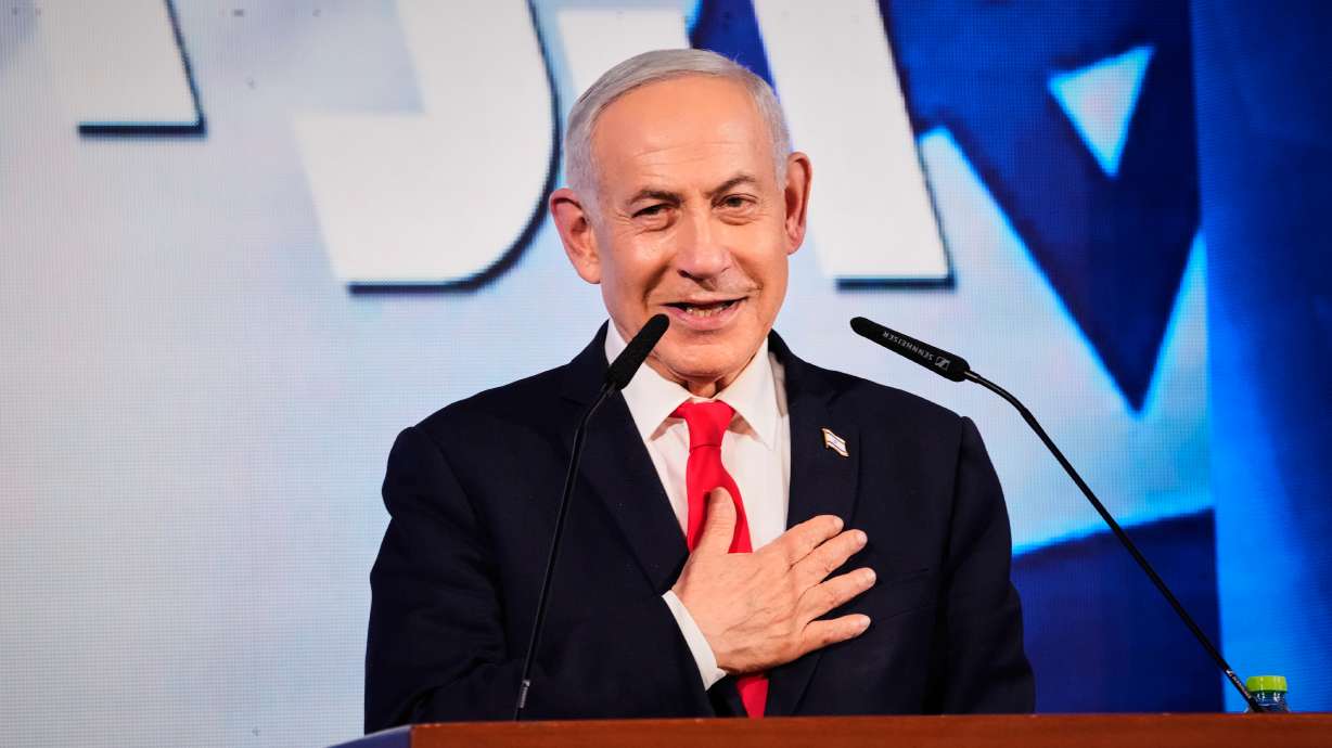 Israeli Prime Minister Benjamin Netanyahu speaks to his supporters at Likud party headquarters in Jerusalem after the release of the first exit poll results in Israel's general election, Wednesday. The final results are being closely watched after the exit polls indicated no clear winner.