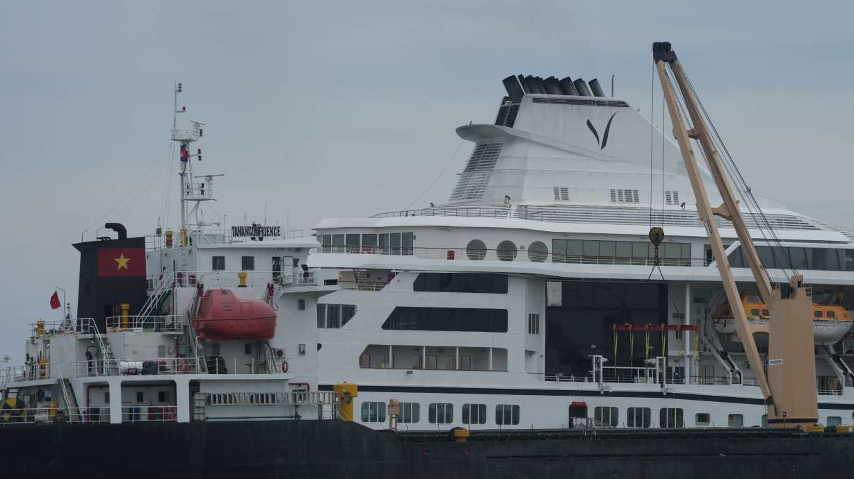A U.S. cruise ship, the MV Odyssey, docks at the Sihanoukville Autonomous Port in Sihanoukville, Cambodia, Wednesday. The ship's global voyage abruptly ended due to fuel costs.