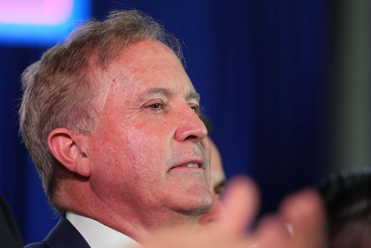 Republican U.S. Senate candidate Texas Attorney General Ken Paxton listens as President Donald Trump speaks at a campaign rally at the Port of Corpus Christi, Tuesday, in Corpus Christi, Texas. The question of personality over policy has become elevated in the state's U.S. Senate race.
