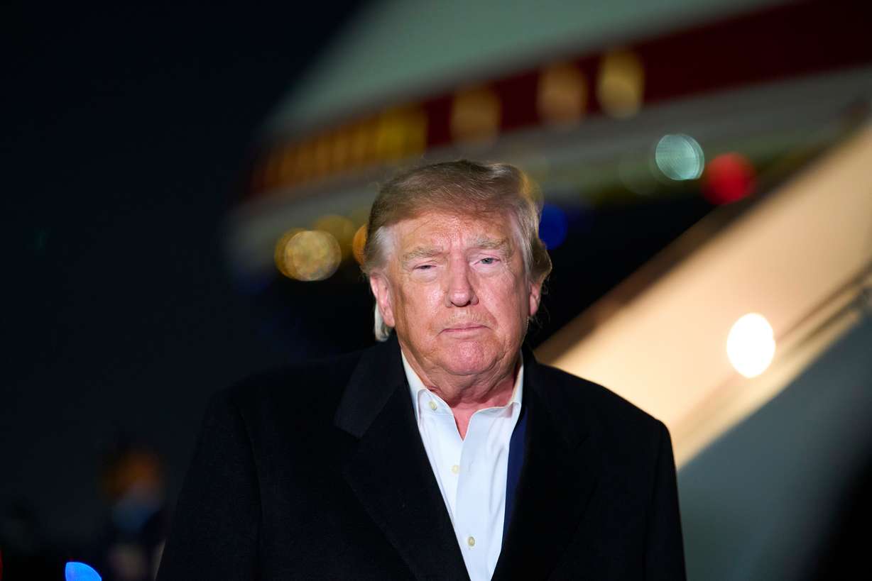 President Donald Trump speaks with reporters as he arrives on Air Force One, Wednesday, at Joint Base Andrews, Md. Trump said he would approve of Flavio Bolsonaro and his family coming to the U.S., calling them "fine people."