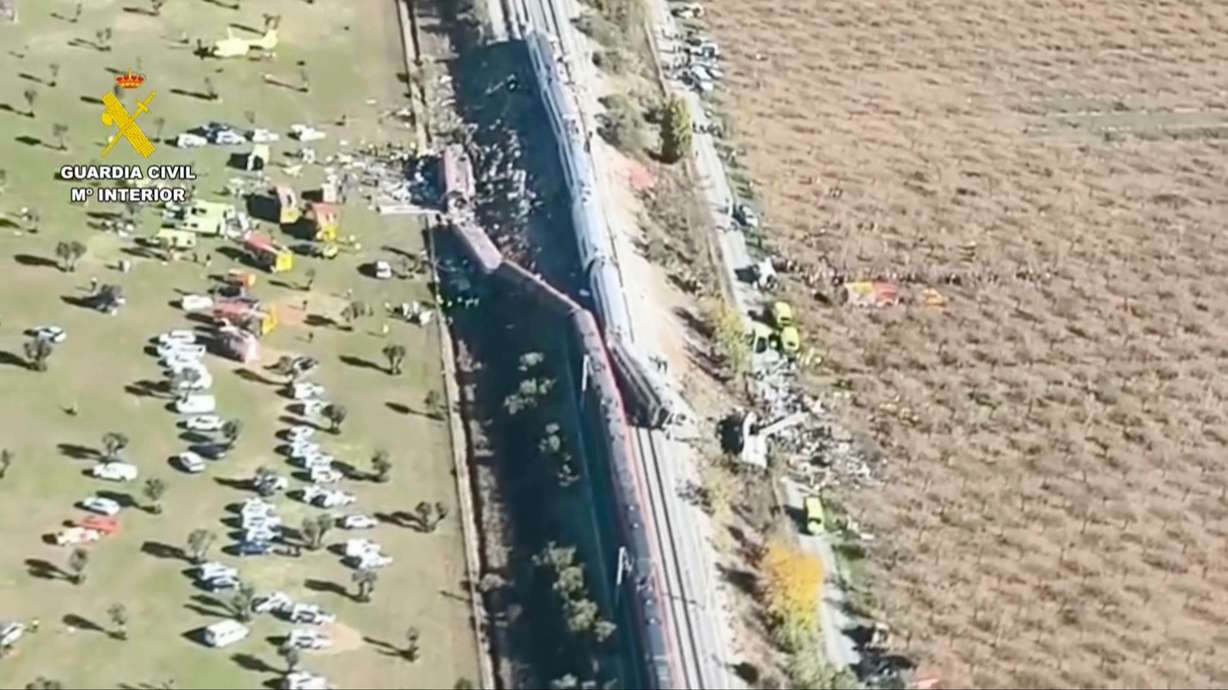 An aerial view of carriages and first responders on the site of a collision between two trains in Urda, Spain, Wednesday. Two cars were derailed, leading to at least 64 people being killed.