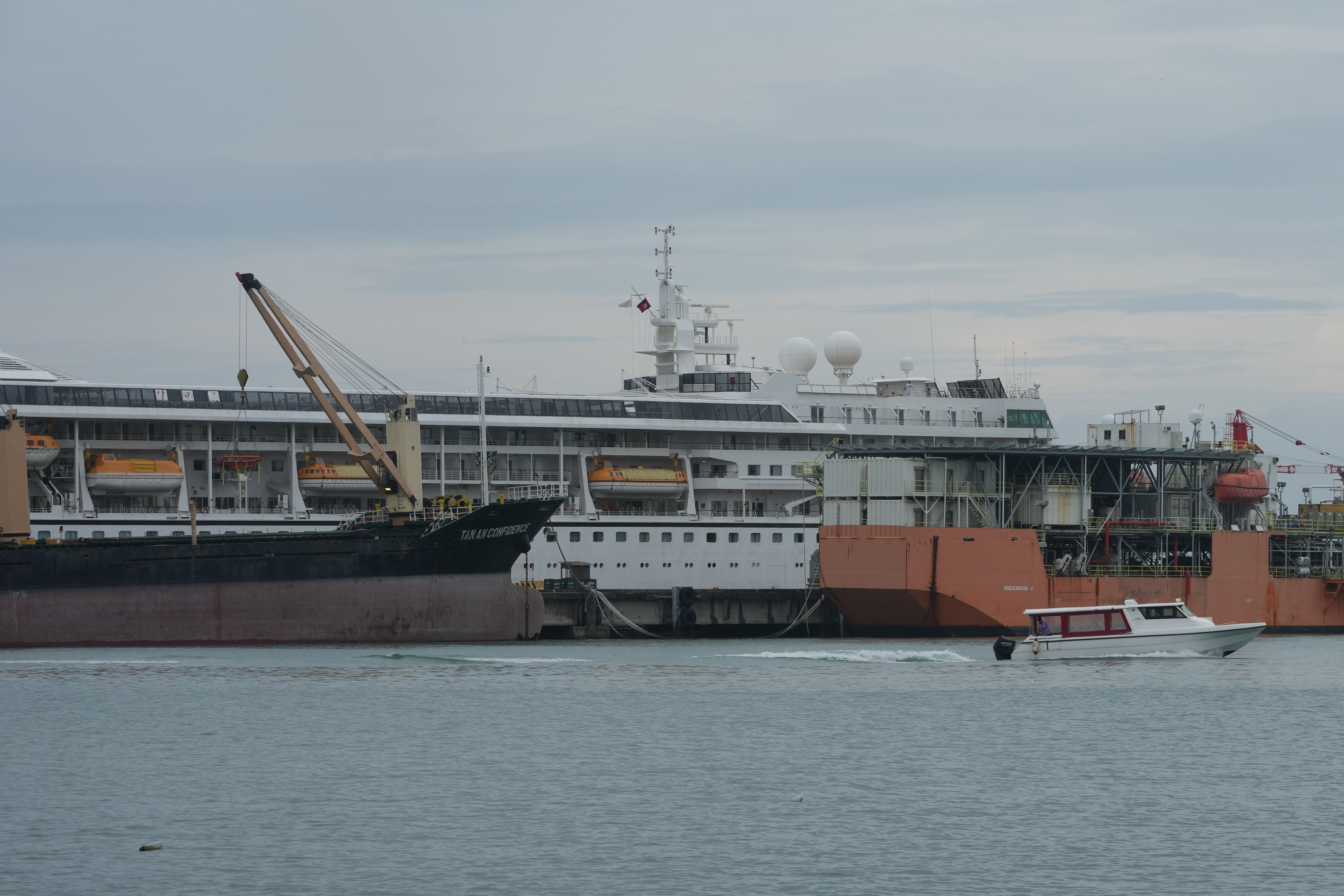 A U.S. cruise ship, the MV Odyssey, docks at the Sihanoukville Autonomous Port in Sihanoukville, Cambodia, Wednesday. The ship suspended its global voyage abruptly due to fuel costs.