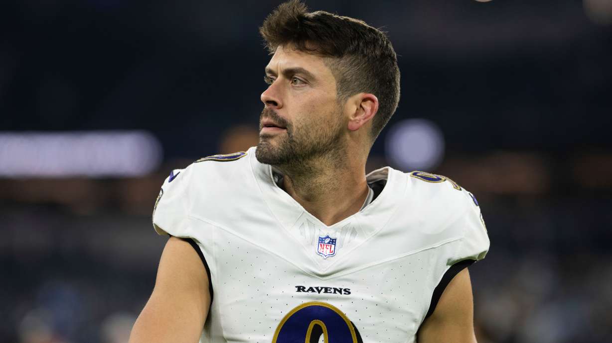 FILE - Baltimore Ravens place kicker Justin Tucker walks back to the locker room after an NFL football game against the Los Angeles Chargers, Nov. 25, 2024, in Inglewood, Calif.