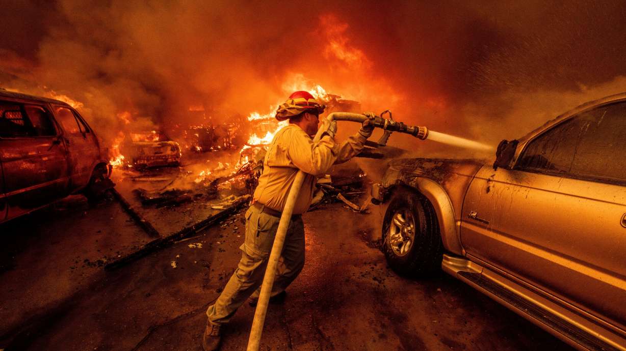 A firefighter battles the Eaton Fire, Jan. 8, 2025, in Altadena, Calif.