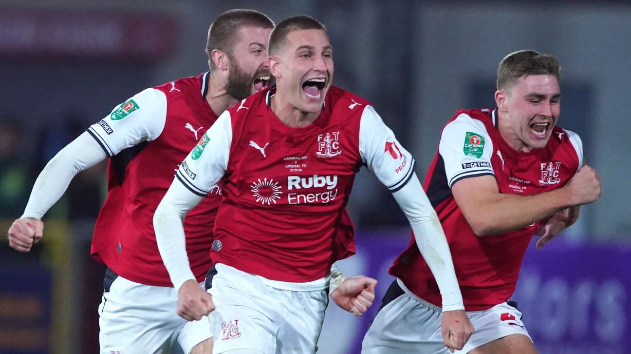 Fleetwood's players celebrate after winning a penalty shootout during the English League Cup soccer match between Fleetwood Town and Arsenal in Fleetwood, England, Tuesday, Oct. 27, 2026.