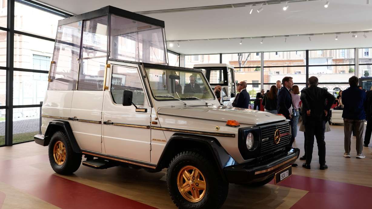 A popemobile used by successive popes is displayed at "A Century of the Popemobile," an exhibition tracing 100 years of papal transportation, from Pope Pius XI's first automobile in 1930 to modern popemobiles, at the Vatican Museums, Wednesday.