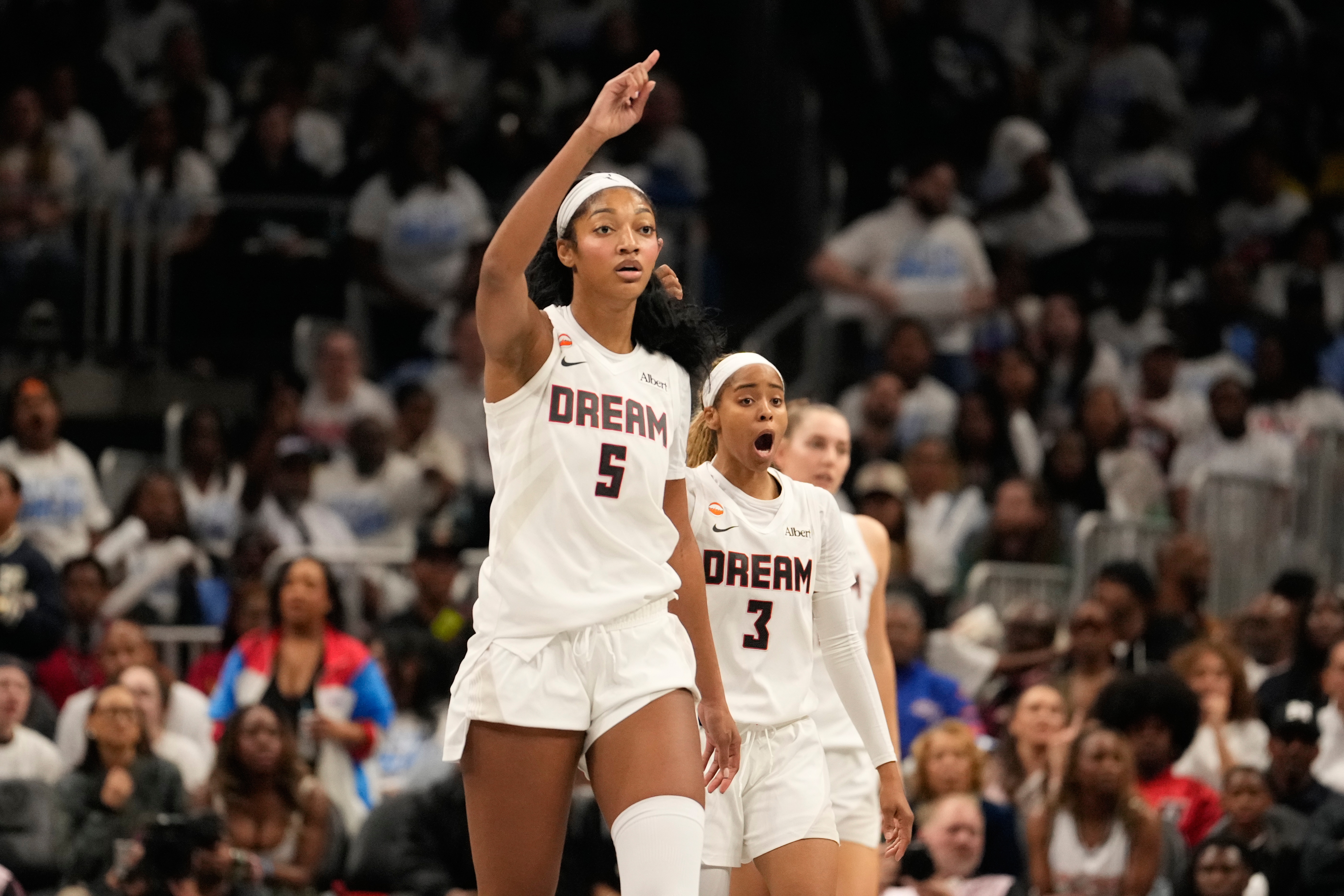 Atlanta Dream forward Angel Reese (5) and Atlanta Dream guard Jordin Canada (3) react to a foul in the second half during Game 4 of the WNBA basketball finals on Saturday, Oct. 24, 2026, in Atlanta. 