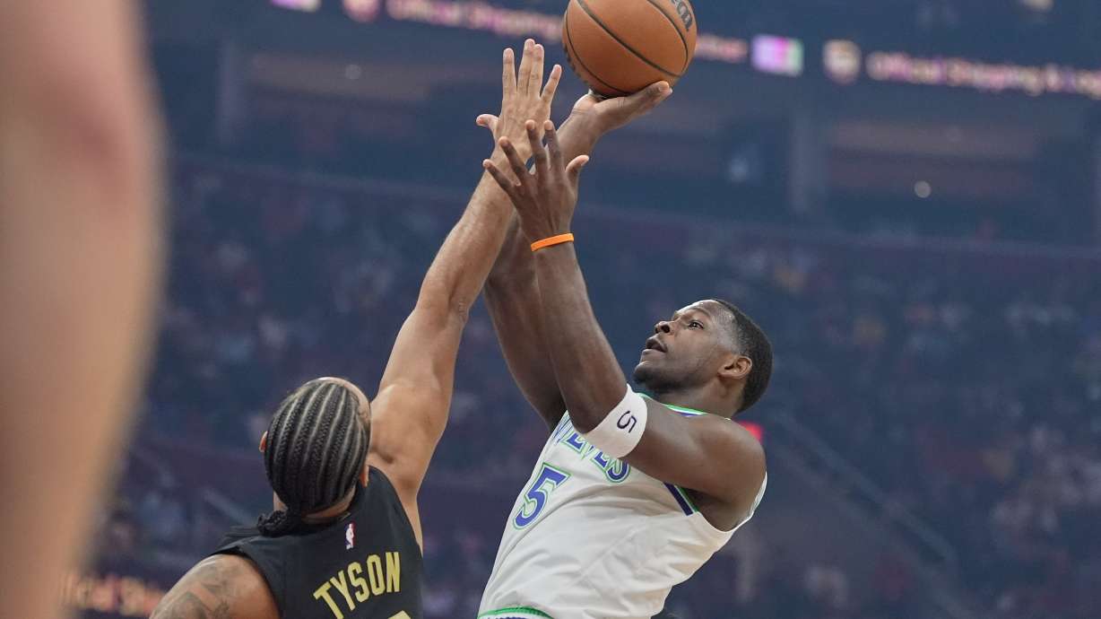 Minnesota Timberwolves guard Anthony Edwards (5) shoots as Cleveland Cavaliers guard Jaylon Tyson (20) defends in the first half of an NBA basketball game, Monday, Oct. 26, 2026, in Cleveland.