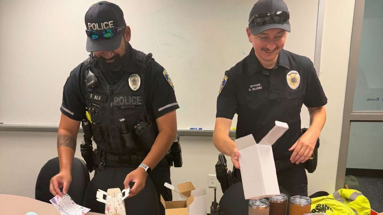 Members of the South Salt Lake Police Department's Homeless Resource Unit prepare comfort kits for people experiencing homelessness.