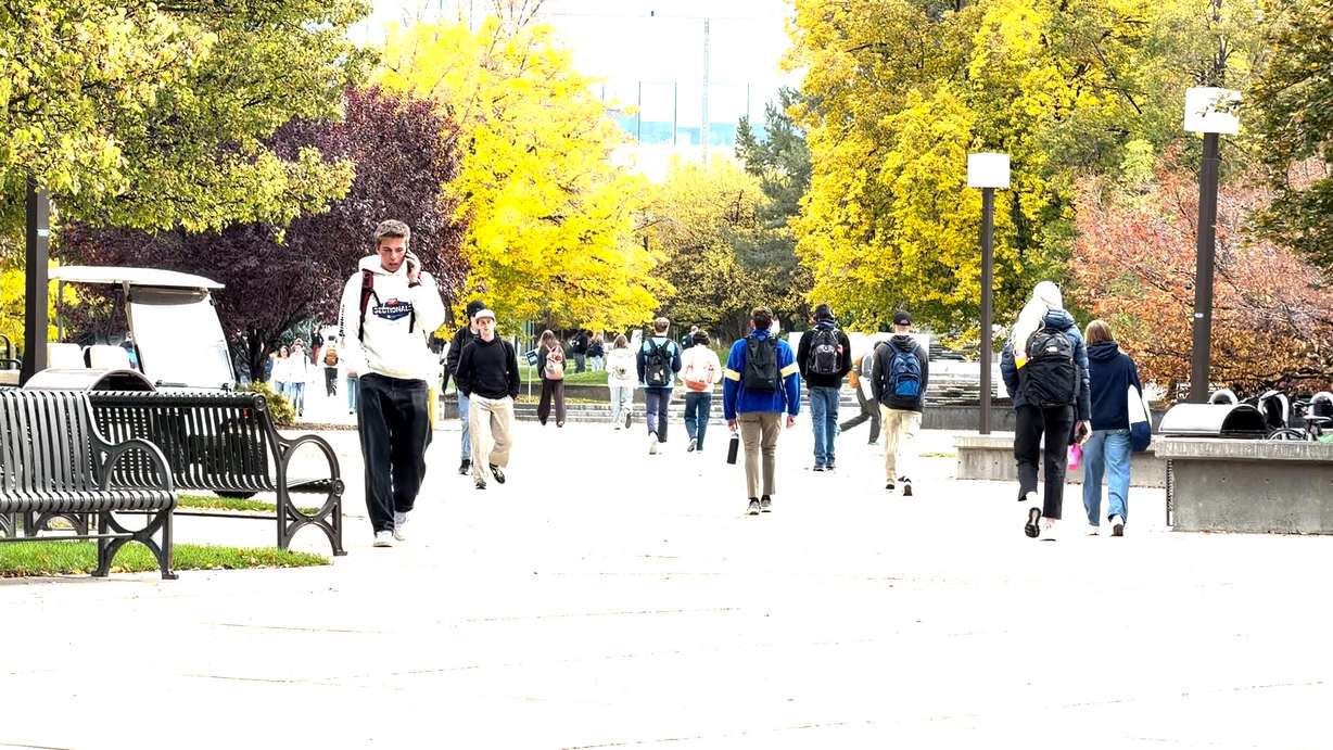 Students walk between classes at Utah State University in Logan.