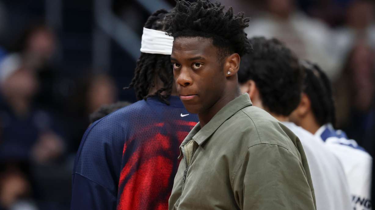 Washington Wizards forward AJ Dybantsa looks on while wearing street clothes during an NBA basketball game against the Toronto Raptors in Washington, Friday, Oct. 23, 2026.