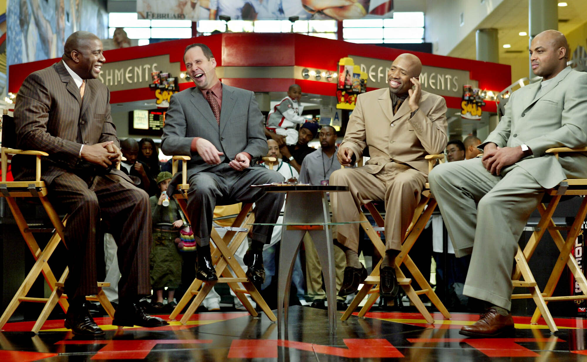 FILE - "Inside the NBA" hosts, from left, Earvin "Magic" Johnson, Ernie Johnson Jr., Kenny Smith, and Charles Barkley prepare for their live broadcast during TNT's NBA doubleheader coverage on Feb. 10, 2004, in the Compton section of Los Angeles. 