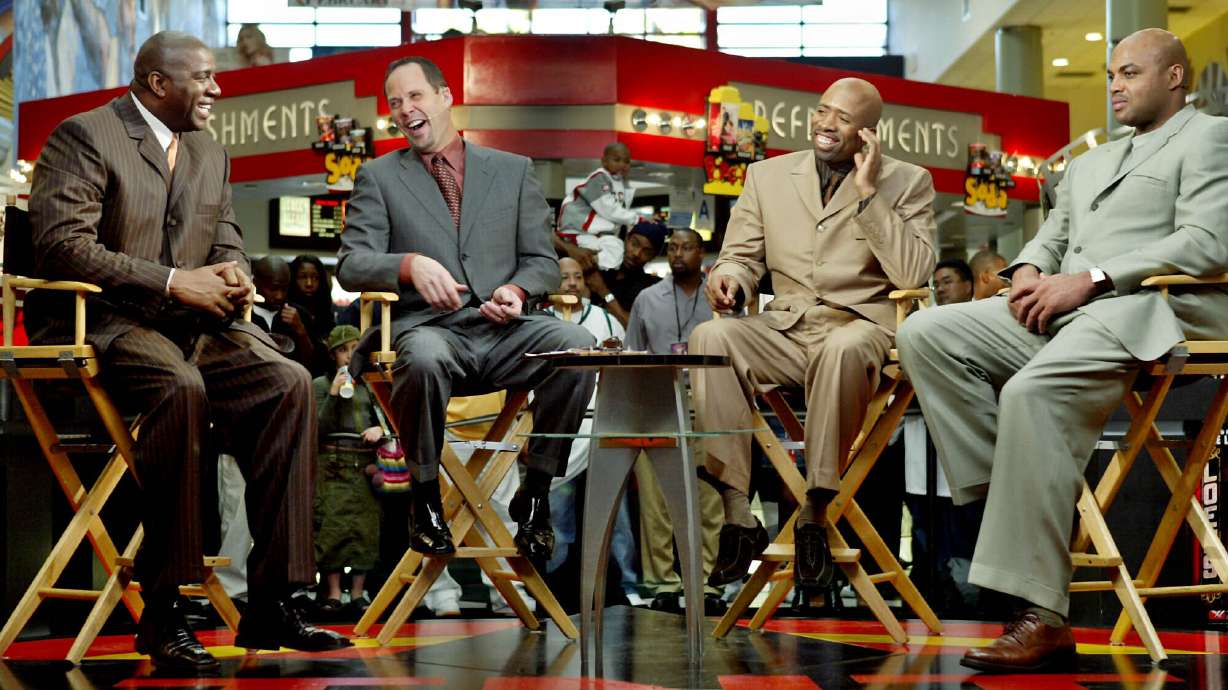 FILE - "Inside the NBA" hosts, from left, Earvin "Magic" Johnson, Ernie Johnson Jr., Kenny Smith, and Charles Barkley prepare for their live broadcast during TNT's NBA doubleheader coverage on Feb. 10, 2004, in the Compton section of Los Angeles.