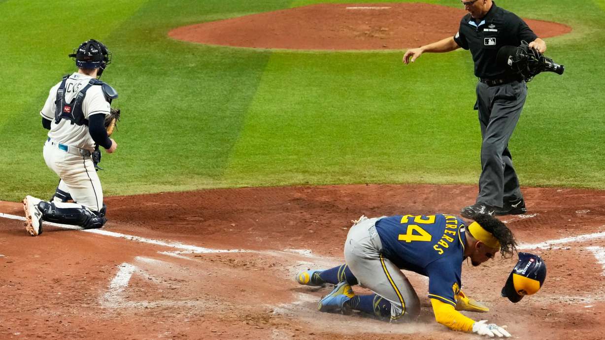 Milwaukee Brewers' William Contreras celebrates after scoring during the sixth inning of Game 5 of baseball's World Series, Wednesday, Oct. 28, 2026, in St. Petersburg, Fla., between the Milwaukee Brewers and the Tampa Bay Rays.
