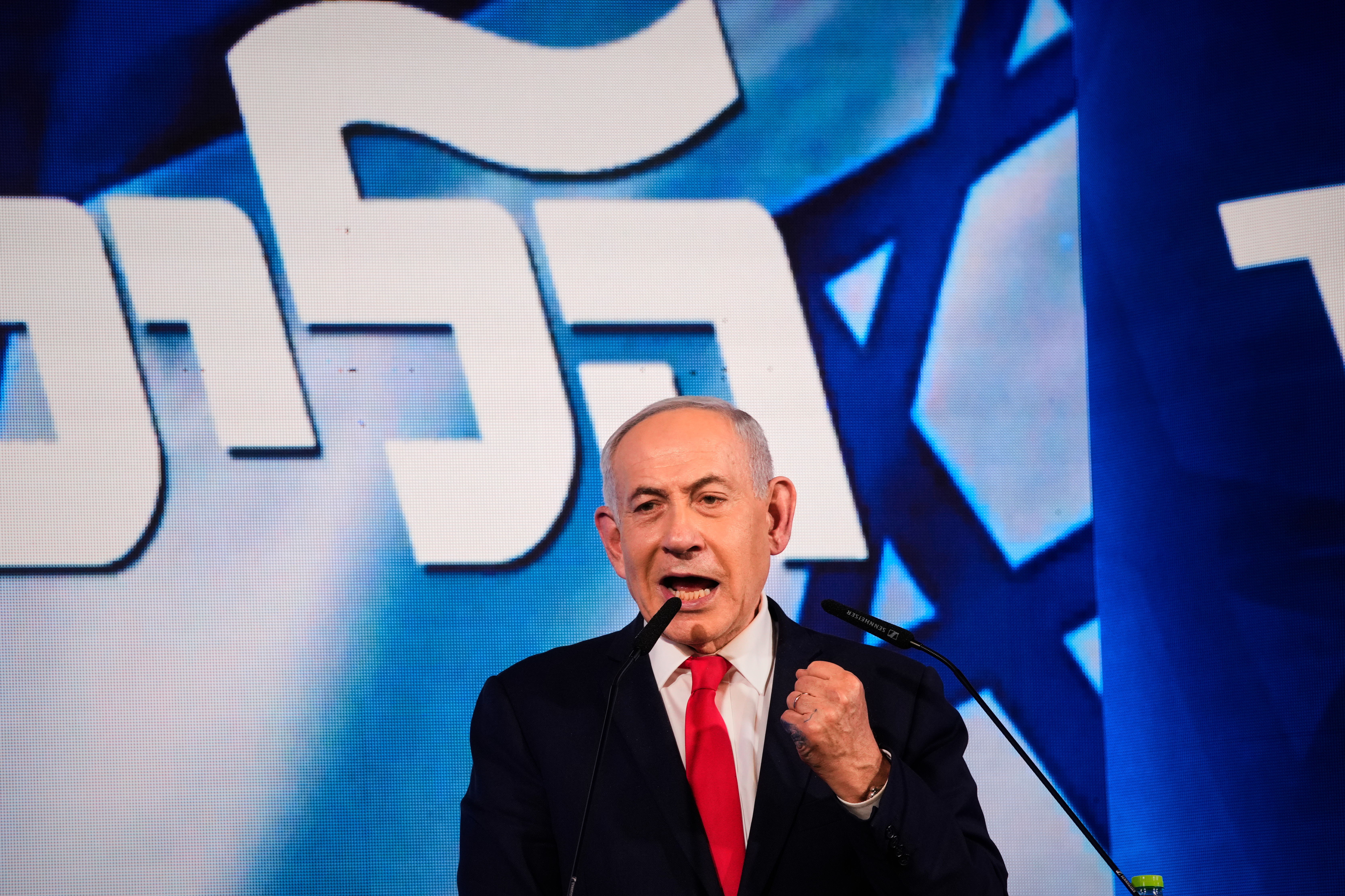 Israeli Prime Minister Benjamin Netanyahu speaks to his supporters at Likud party headquarters in Jerusalem after the release of the first exit poll results in Israel's general election, Wednesday. Preliminary results showed on Thursday that Netanyahu's party lost its majority in parliament.