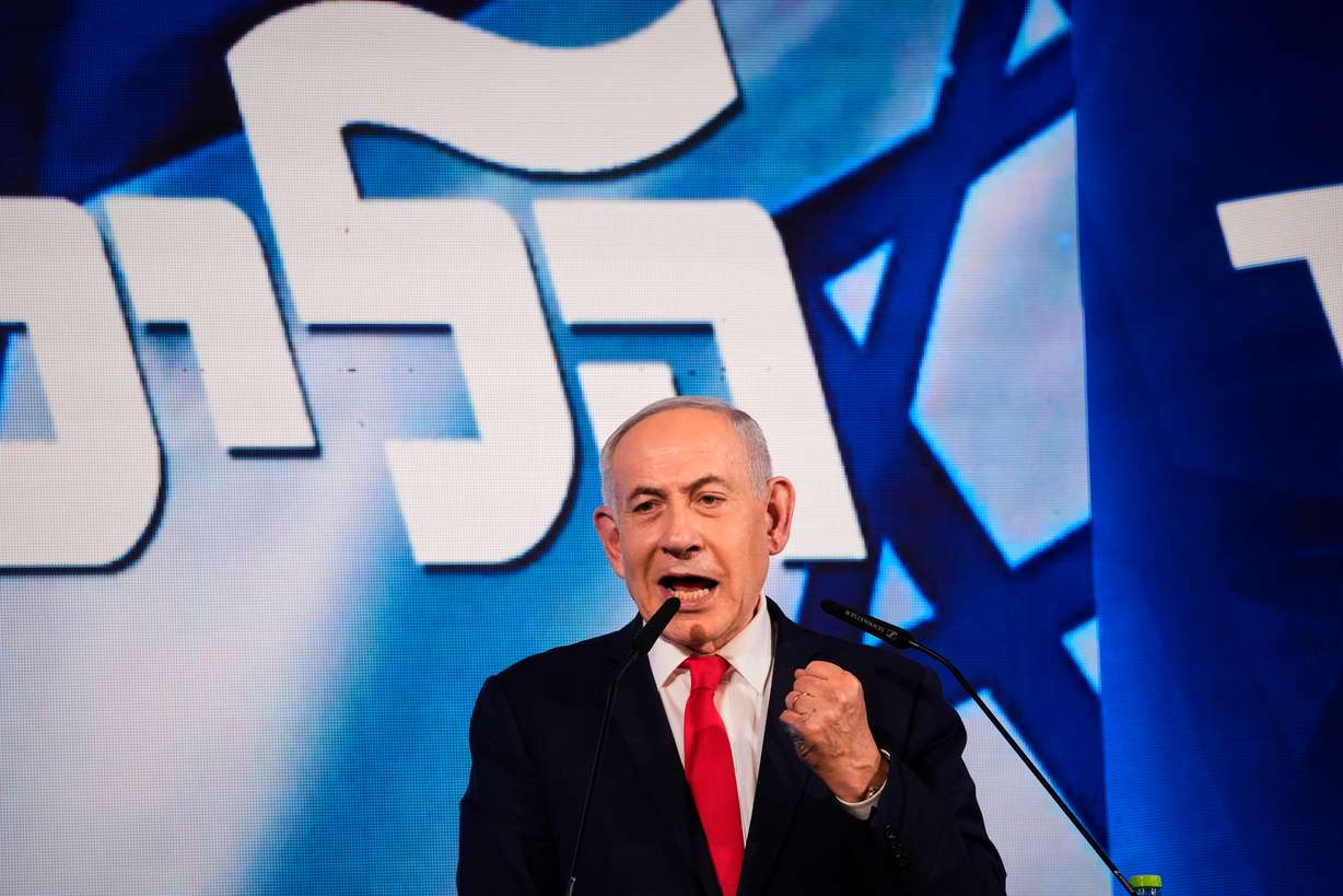 Israeli Prime Minister Benjamin Netanyahu speaks to his supporters at Likud party headquarters in Jerusalem after the release of the first exit poll results in Israel's general election, Wednesday. Preliminary results showed on Thursday that Netanyahu's party lost its majority in parliament.