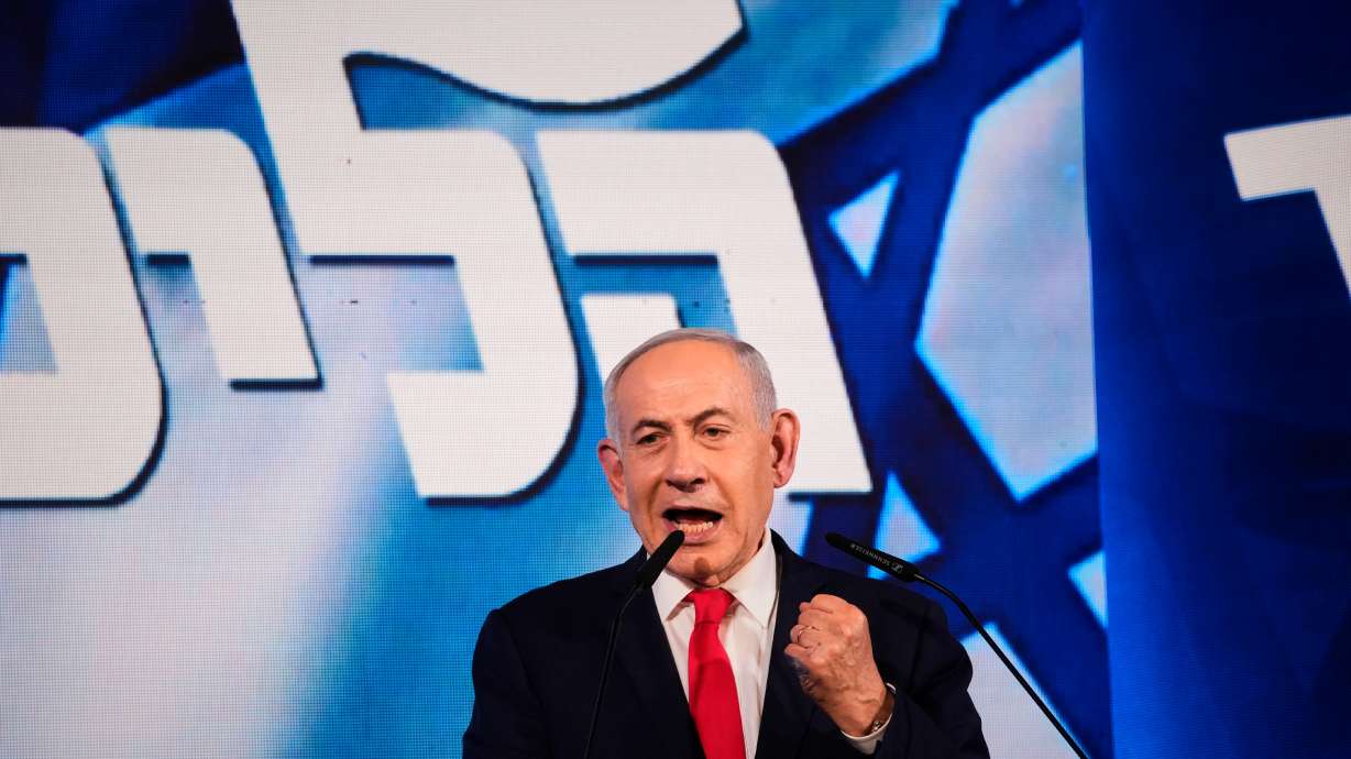 Israeli Prime Minister Benjamin Netanyahu speaks to his supporters at Likud party headquarters in Jerusalem after the release of the first exit poll results in Israel's general election, Wednesday.