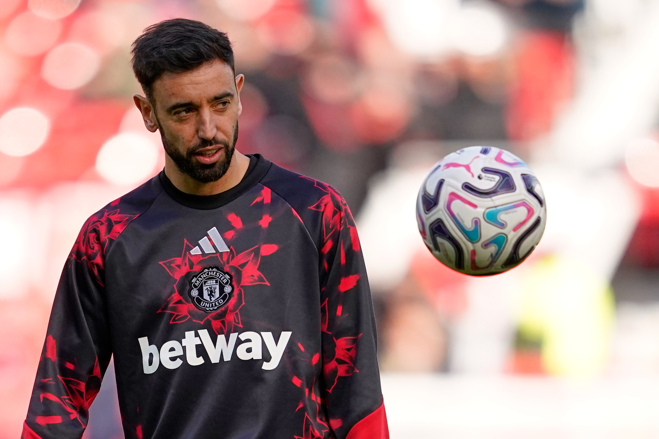 Manchester United's Bruno Fernandes warmns up ahead of the start of the English Premier League soccer match between Manchester United and Bournemouth in Manchester, England, Sunday, Oct. 25, 2026. 