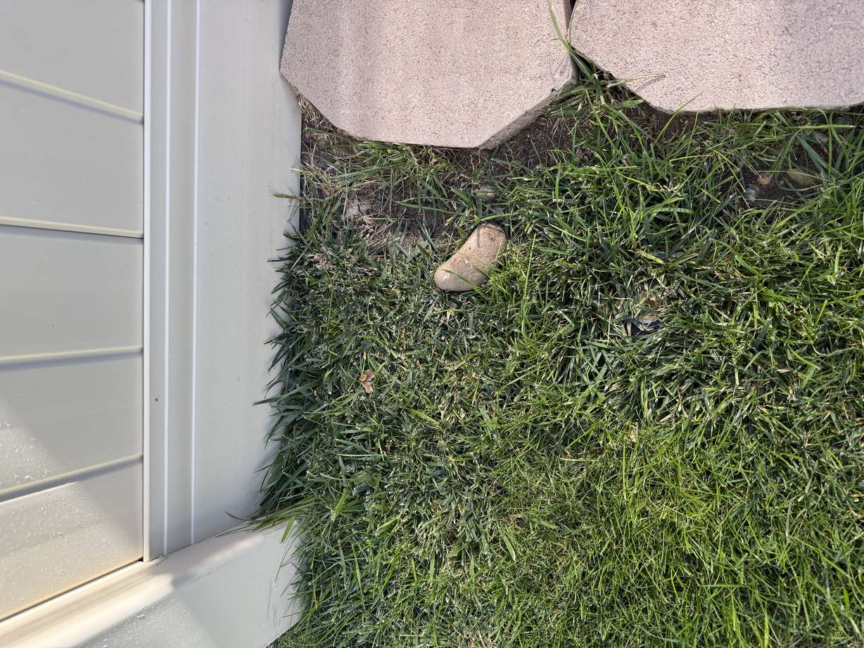 A rock from a nearby explosion that landed in Joanne Bolnick's backyard is pictured.