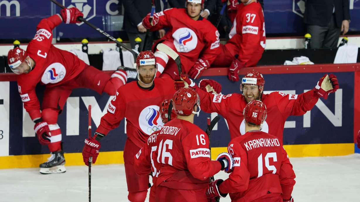 FILE - Russia players celebrate during the Ice Hockey World Championship group A match between the Russia and Sweden in Riga, Latvia, May 31, 2021.