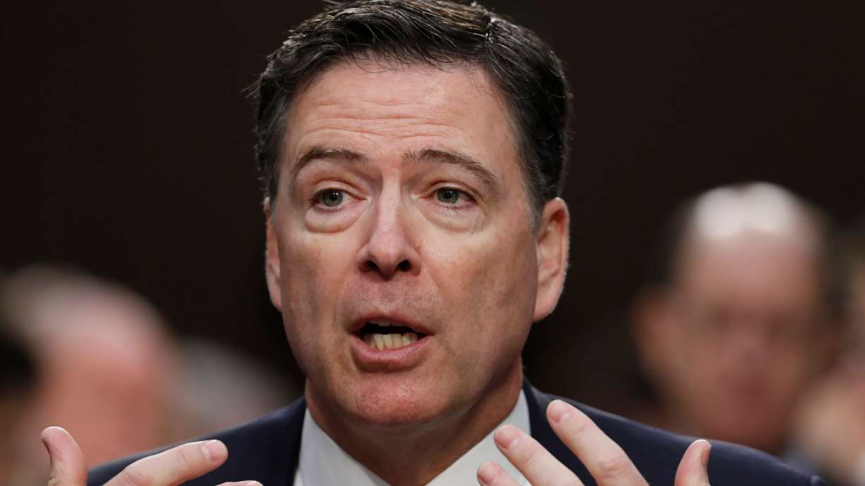 Former FBI Director James Comey speaks during a Senate Intelligence Committee hearing on Capitol Hill, June 8, 2017, in Washington. A federal judge on Friday put off a decision to dismiss another placeholder criminal case against Comey.