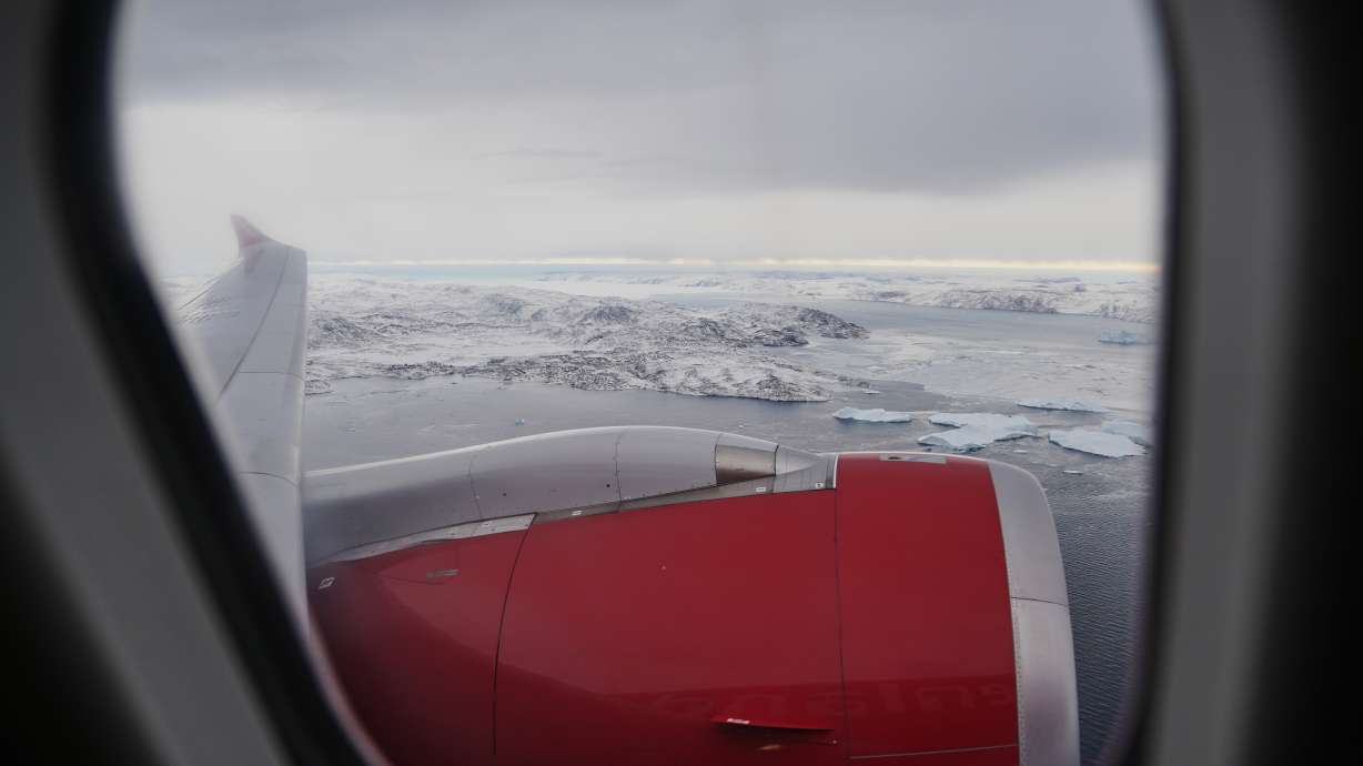 Icebergs seen throughout the window of a plane at the first-ever direct flight from Copenhagen to lulissat, Greenland, on Thursday.