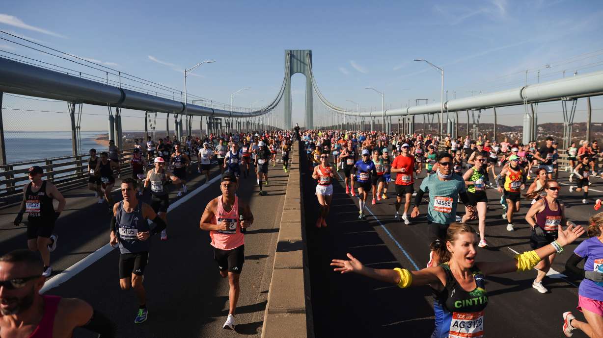 Runners make their way across the Verrazzano Narrows Bridge during the New York City Marathon, Nov. 2, 2025, in New York. Joanne Navarra, a volunteer with the marathon for over 50 years, calls the start line more exciting than the finish.