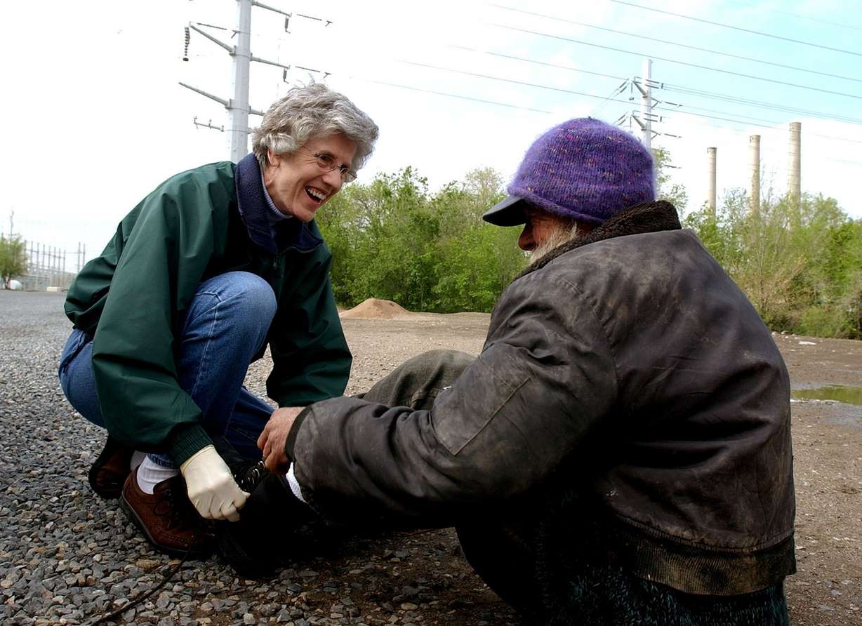 Pamela Atkinson fits Pappy with new boots on May 8, 2003. Atkinson died on Oct. 10 at the age of 93.