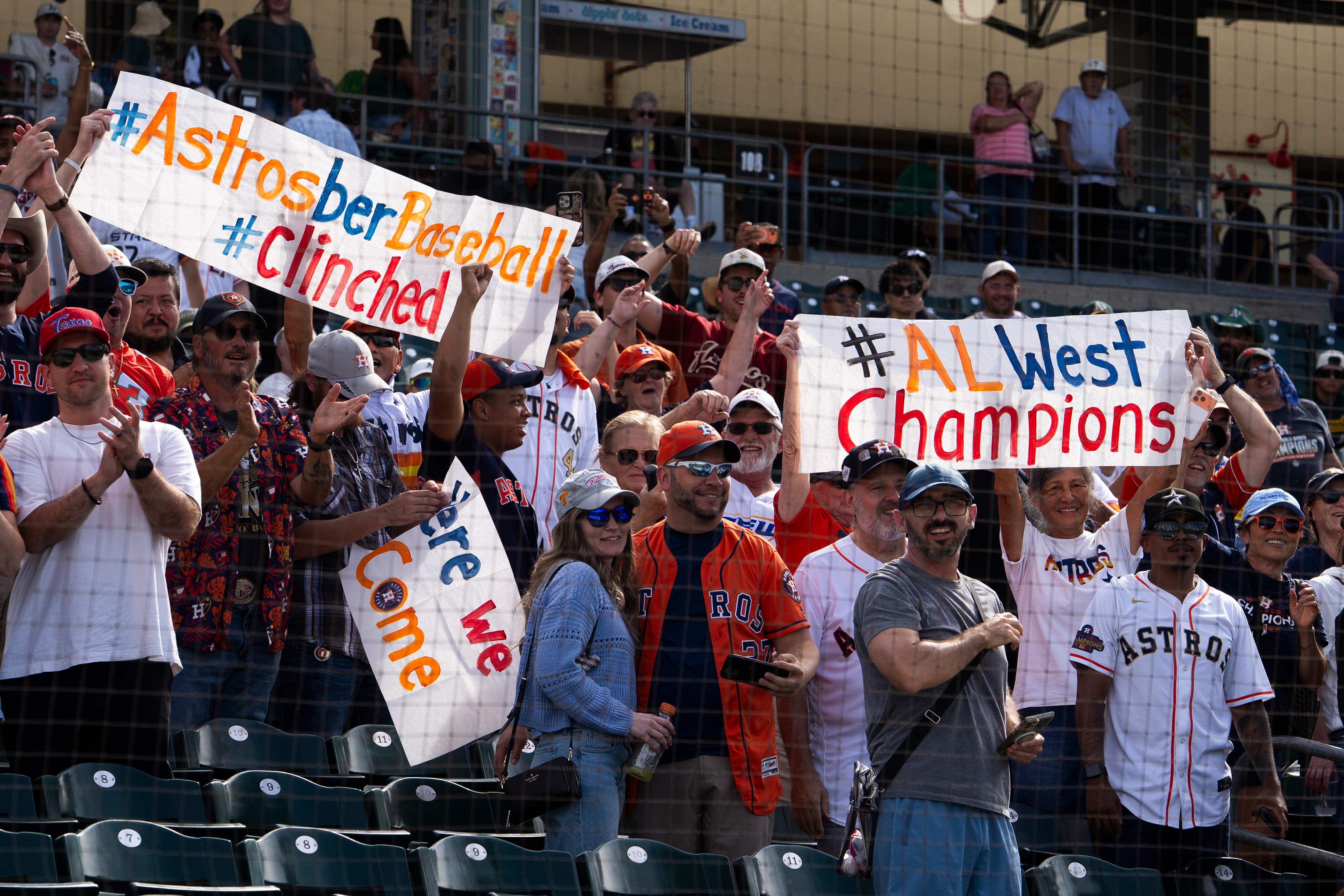 Houston Astros fans cheer after defeating the Athletics 9-0 to win the American League West during an MLB baseball game at Sutter Health Park in Sacramento, Calif., Sunday, Sept. 27, 2026. 
