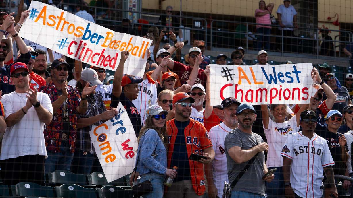 Houston Astros fans cheer after defeating the Athletics 9-0 to win the American League West during an MLB baseball game at Sutter Health Park in Sacramento, Calif., Sunday, Sept. 27, 2026.